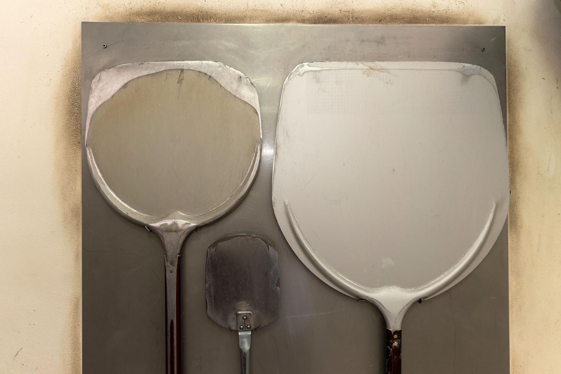 Three pizza shovels