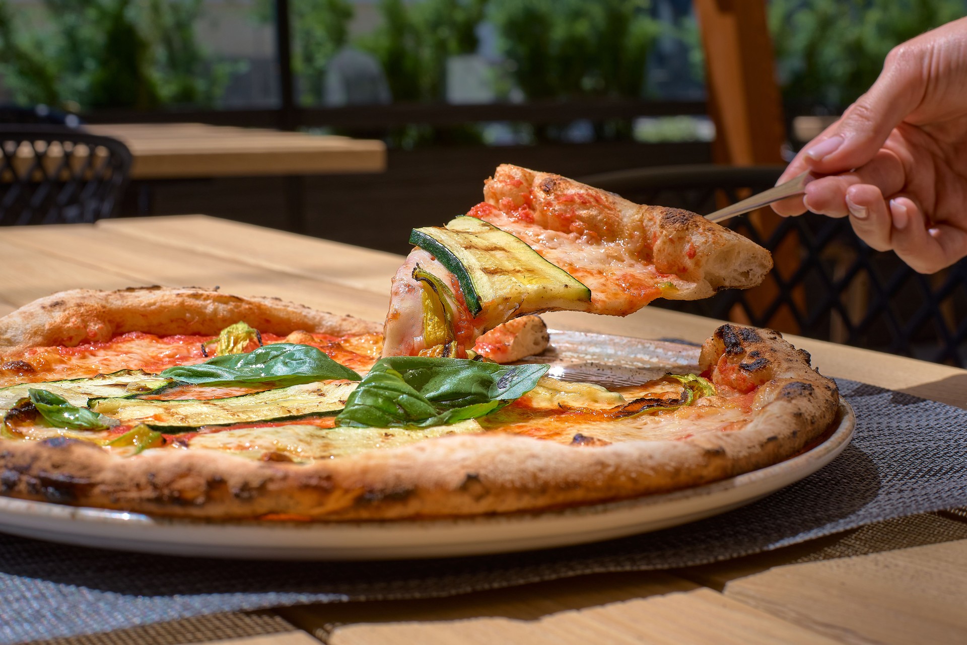 Delicious zucchini flower pizza, Italian Food on the terrace closeup